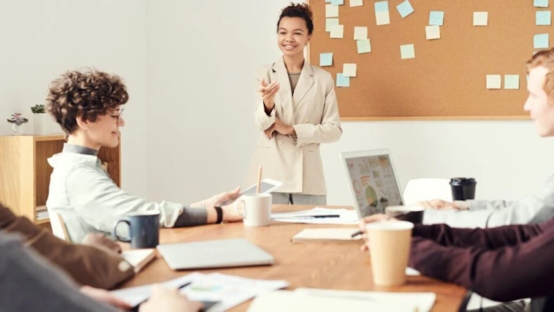 Team meeting in front of board filled with sticky notes